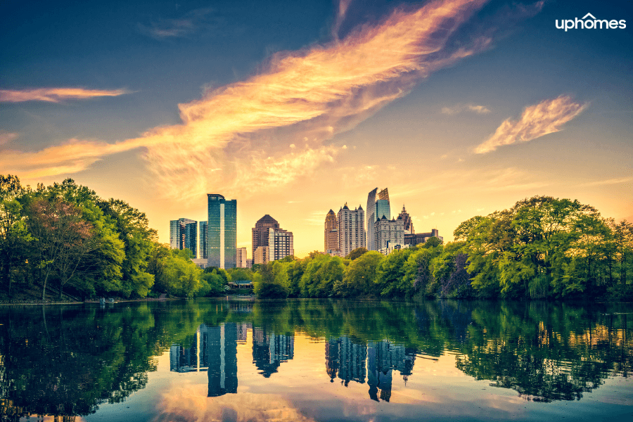 Beautiful picture of the Atlanta skyline and water from the bridge with the sun beginning to set