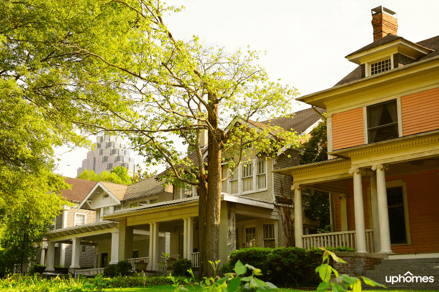 Atlanta Neighborhood with homes in the foreground and the city of Atlanta skyline in the background - Historic Atlanta neighborhoods