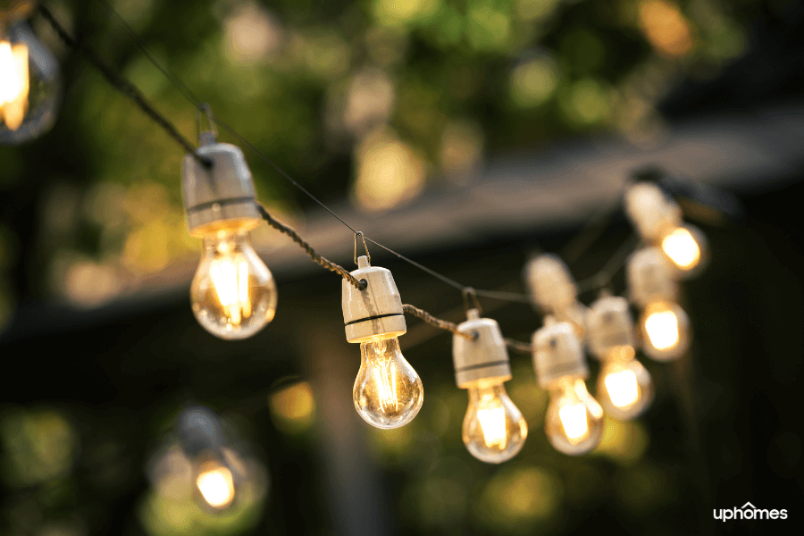 Creating a beautiful backyard starts with vibes and energy - the photo of string lights shows how amazing they can be when added to your backyard