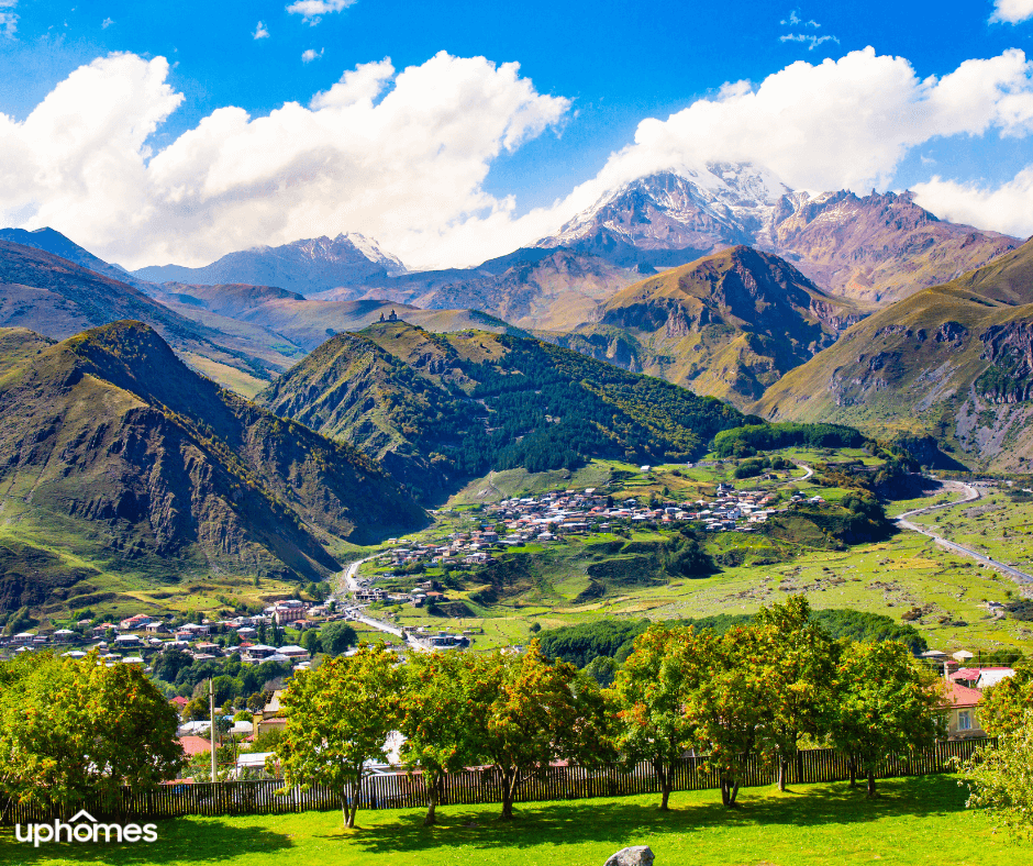 Mountains in Georgia - A small city with a mountain view in the background and clear skies in the Georgia Mountains