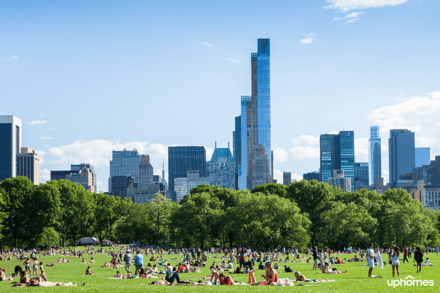 Central Park New York City with people enjoying a sunny day outside and relaxing