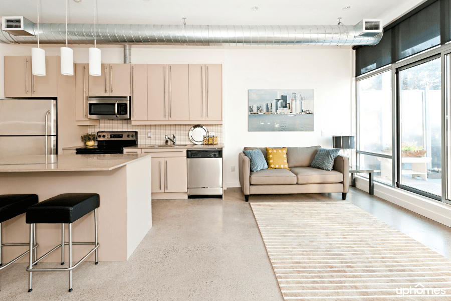 Condo complex kitchen with windows and bright light coming in