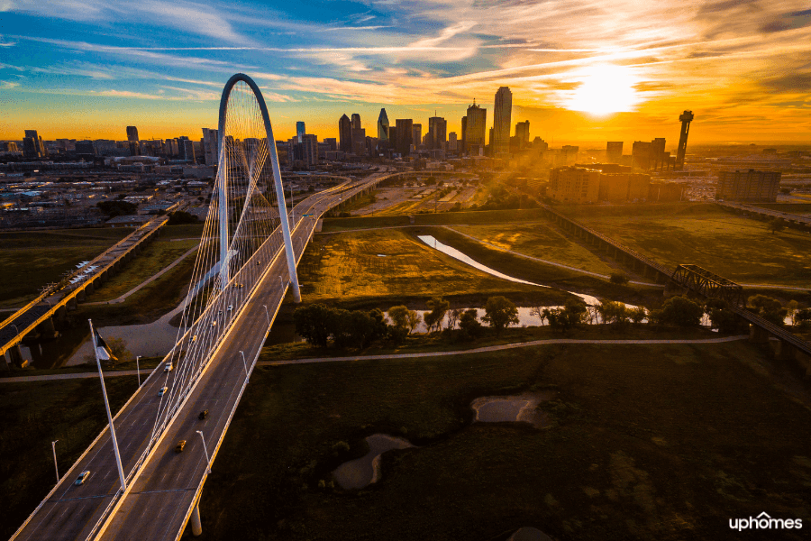 Downtown Dallas Skyline with the sun setting in the background over the Dallas bridge