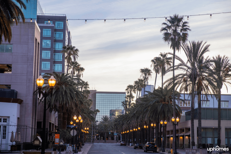 Downtown Anaheim California with buildings and lights at sunset