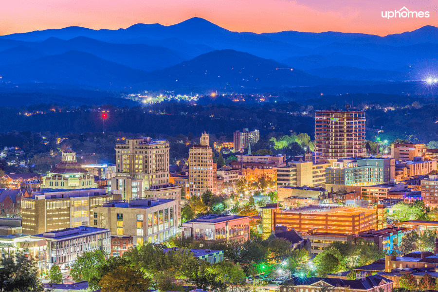 Downtown Asheville, NC with the mountains in the background and a beautiful sunset - Asheville NC really is a charming city