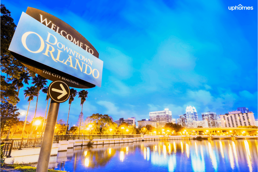 Welcome to Downtown Orlando, FL with bright lights at sunset crossing over the bridge