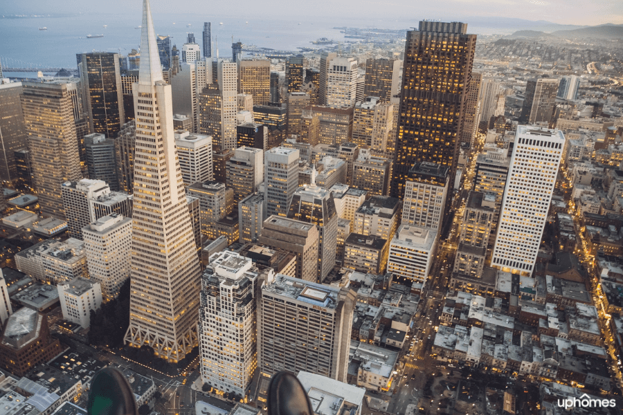 Downtown San Francisco, California at night time with the lights and the sunset