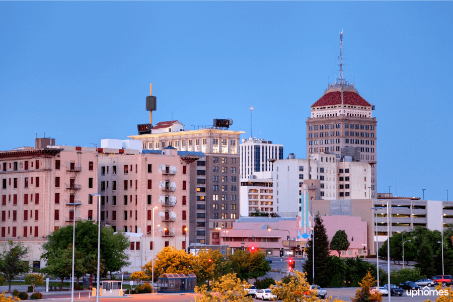 Downtown Fresno, CA at night time with city lights at dusk