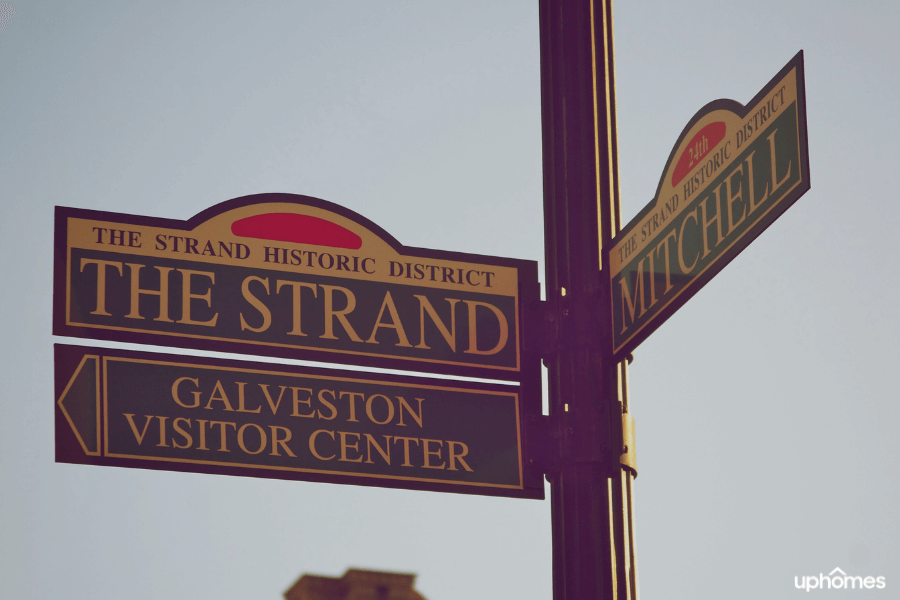 Galveston TX street signs and visitor welcome sign