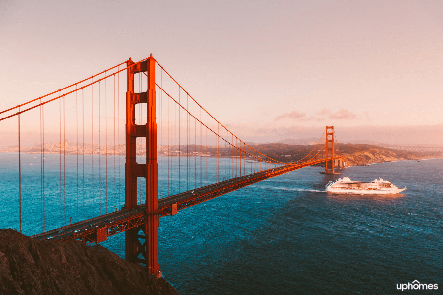 The golden gate bridge in San Francisco California on a sunny day with a cruise ship
