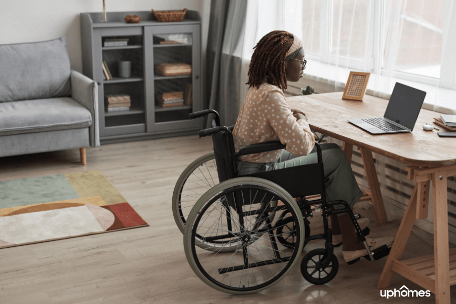 Home Office Handicap Accessible for person in wheelchair sitting at their desk in their home office