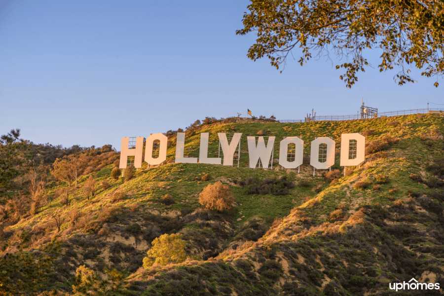 Hollywood Sign on the outskirts of Los Angeles California on a sunny day with the sunsetting