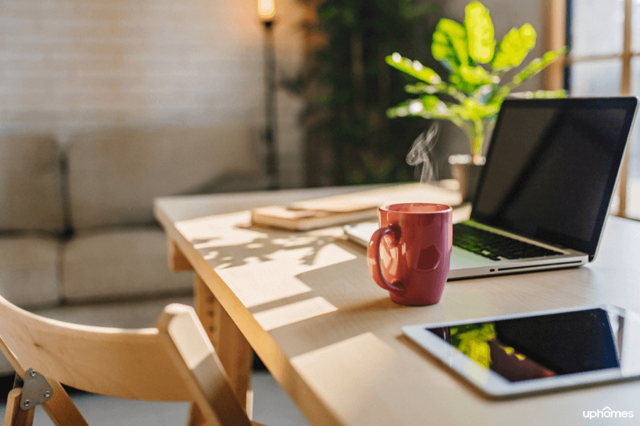 Home Office Setup: What a productive home office set up looks like with bright natural light coming in from the windows, plants on the desk and the right ergonomics in the home office 