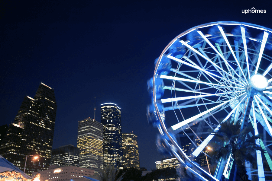 Downtown, Houston TX Ferris Wheel at night time with a view of downtown in the background