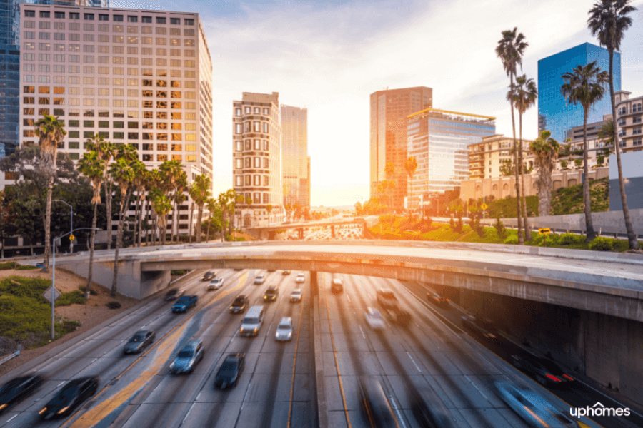 Lots of traffic in Los Angeles with the streets of downtown congested due to the high population density of LA