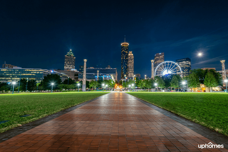 Night time photo of the city of Atlanta, GA with a dark sky and a lit up city from a local Atlanta parks
