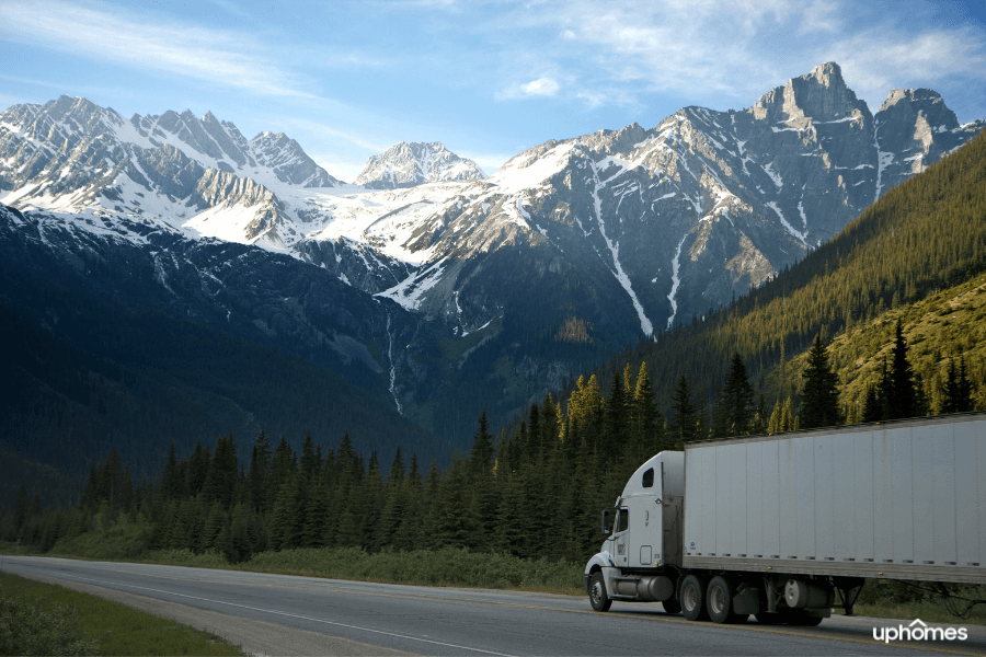 Moving Truck on the highway with mountains in the background