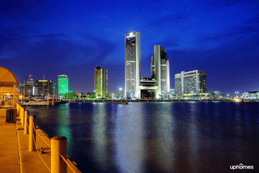 Night time in Corpus Christi, TX with skyline and water