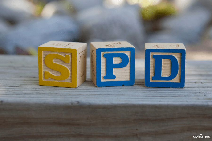 SPD blocks lined up in a way that spells spd for Sensory Processing Disorder