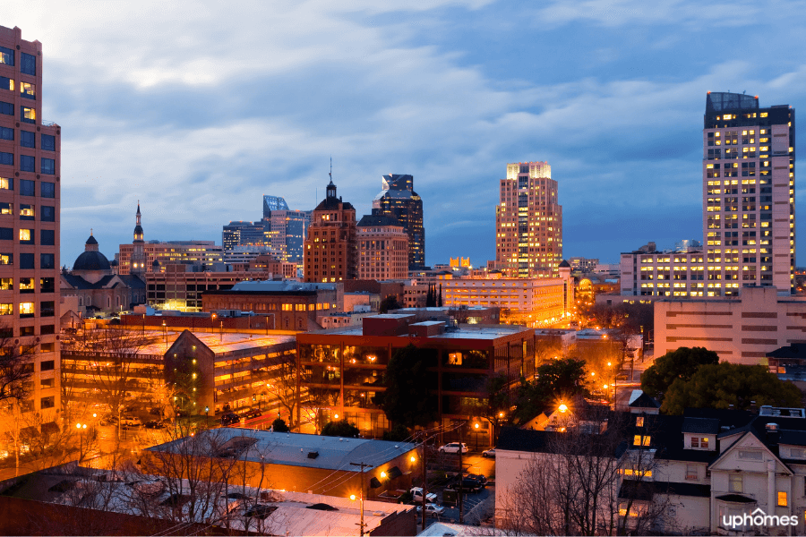 A view of the Sacramento, CA city skyline at night time with the city lights