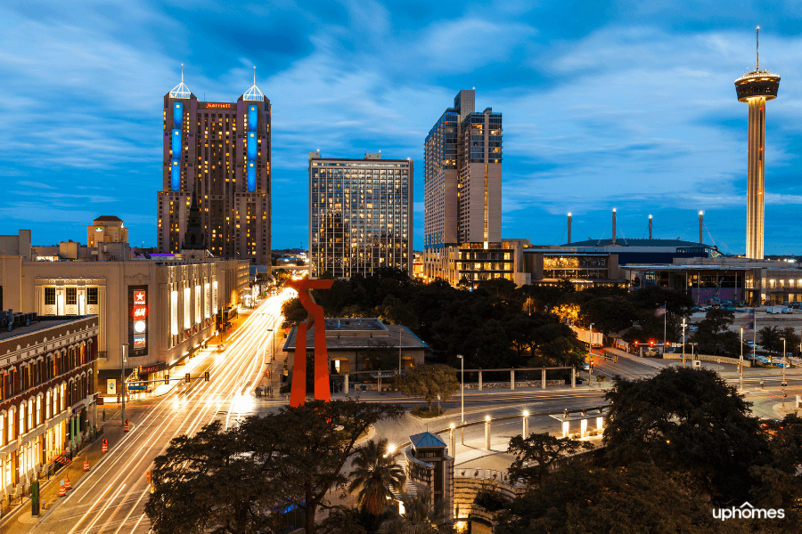 Downtown San Antonio, TX skyline at night time as the sun is setting