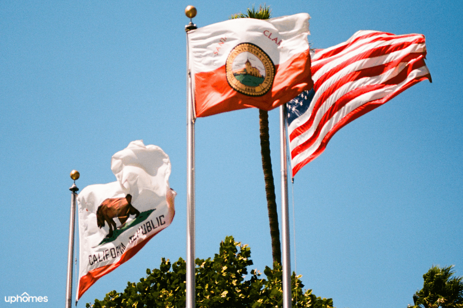 Santa Clara, Ca flag waving proudly in the sky with the usa flag and california republic flag