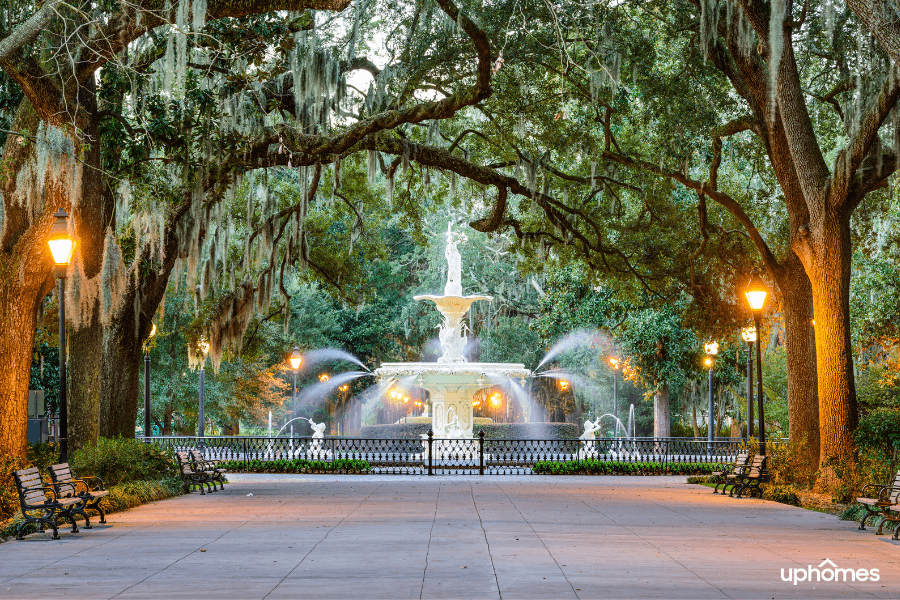 Svannah GA waterfountain and wheeping willow trees with a beautiful sidewalk at night time