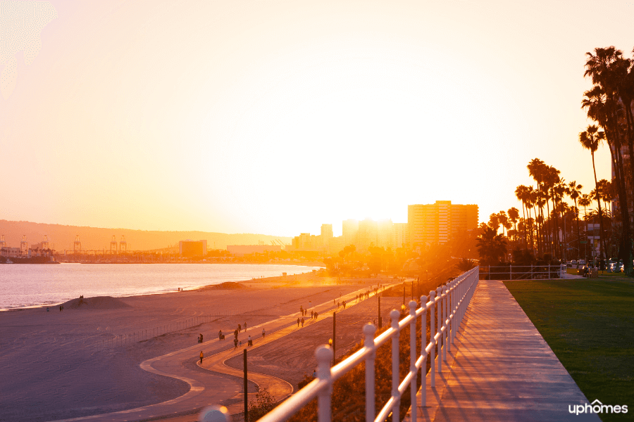 Long Beach, CA - A view of the beach at sunset with beautiful sand and walkway