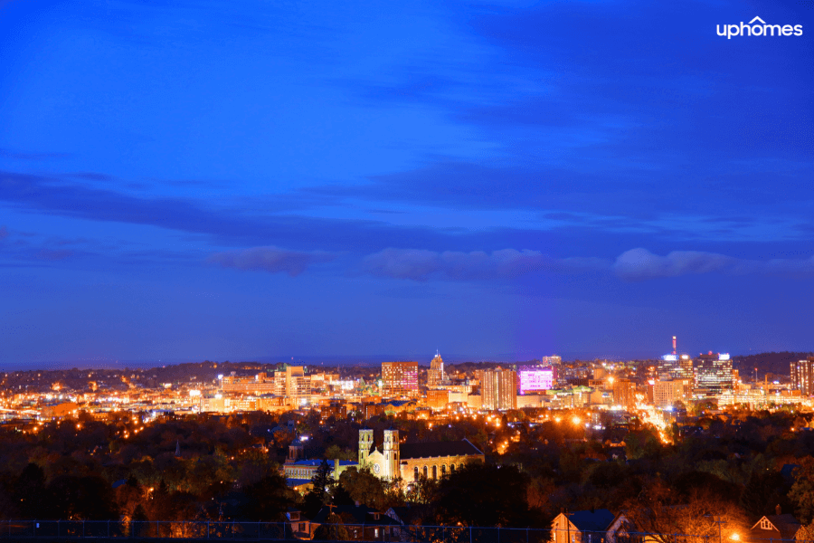 Syracuse NY Skyline and neighborhoods aerial view at night time
