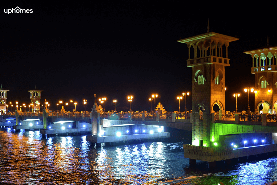 Waterfront of the city of Alexandria at night time with city lights 