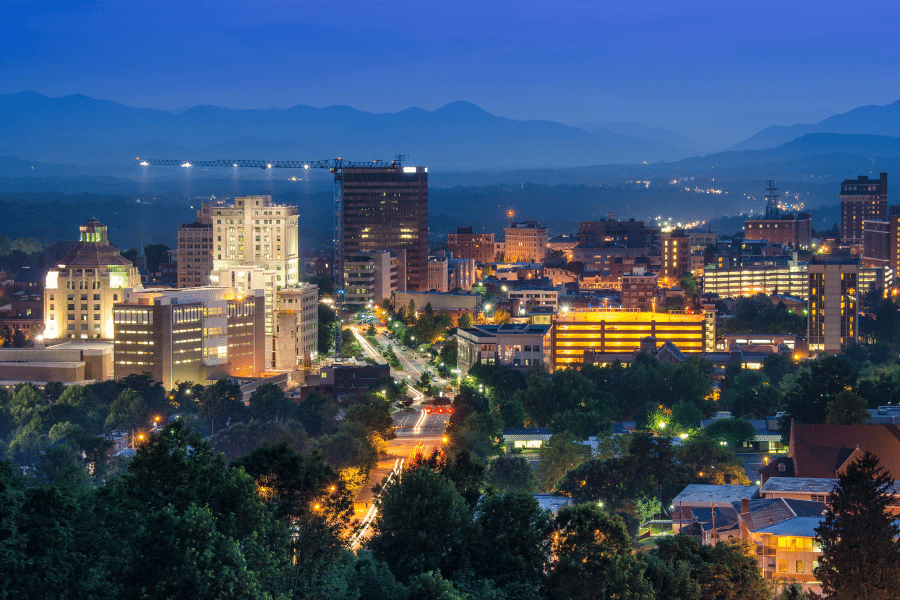 A photo of the downtown city skyline of Asheville NC at sunset