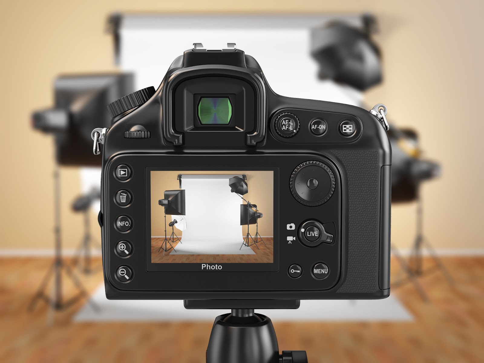Close-up of the preview screen on a digital camera pointed at lights around a white backdrop inside a home.
