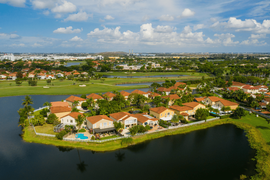 Beautiful neighborhoods in Pensacola aerial view with green grass