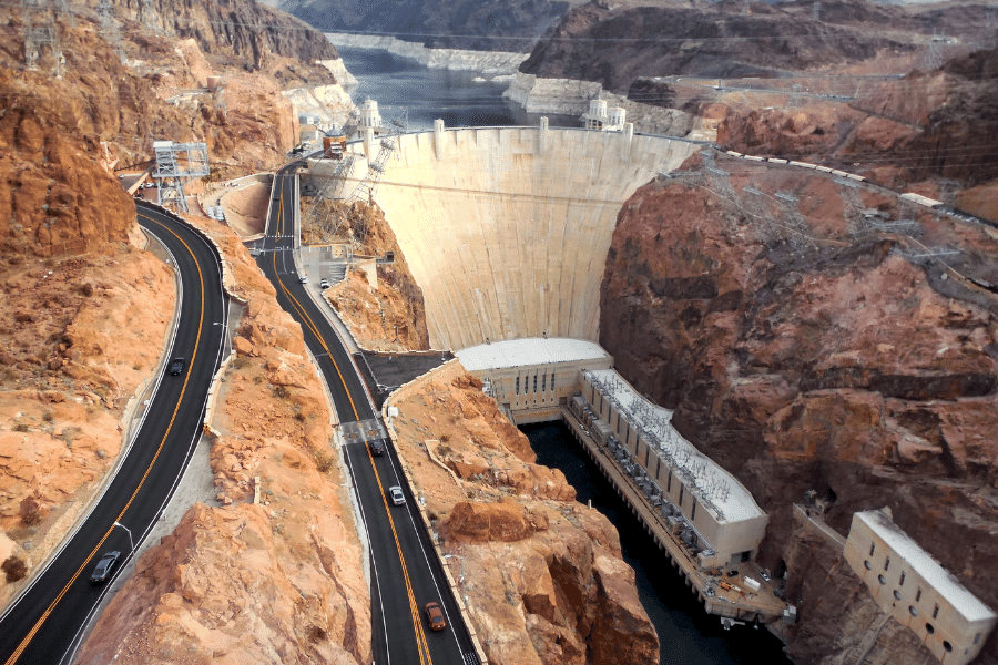 The Hoover Dam with cars driving on the streets 