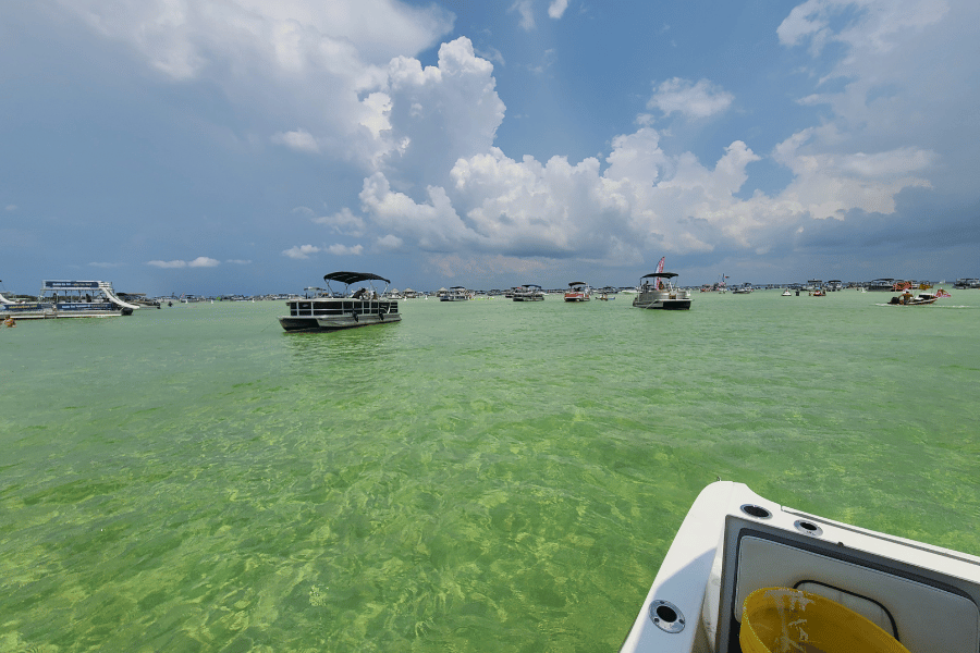 Boats and emerald water at Crab Island in Destin 