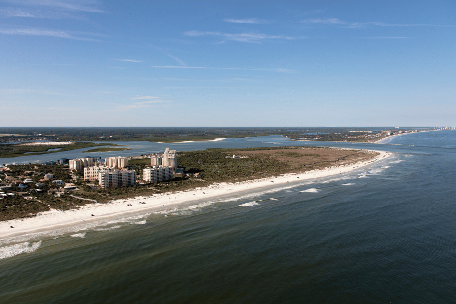 Aerial view of Ponce Inlet with white sand and blue water