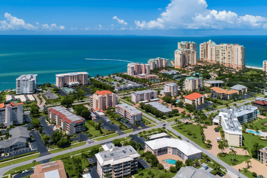 Tall buildings and homes near the blue water in Marco Island, FL 