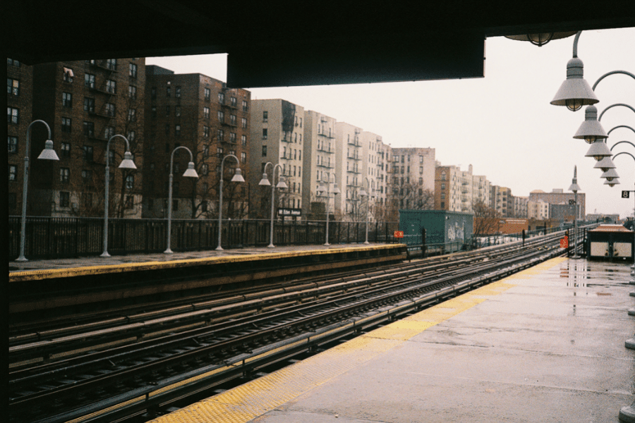 The Bronx on a rainy day with buildings and the subway station