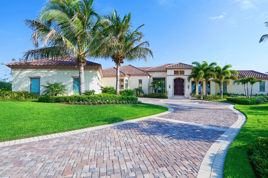 Luxury home in Florida neighborhood palm trees Spanish style expensive real estate