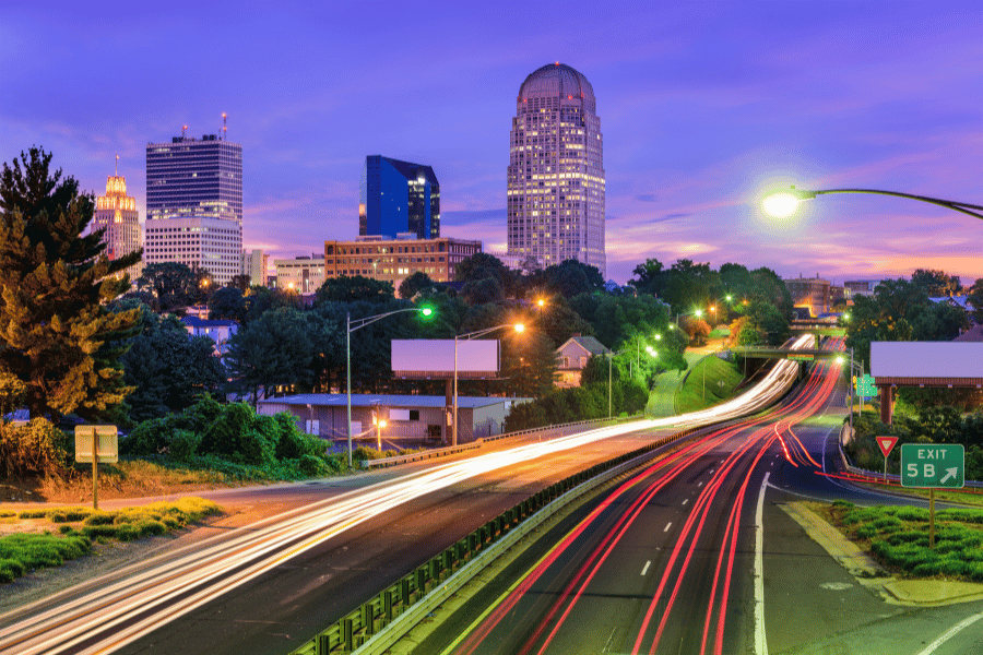 Downtown Winston-Salem at night with car lights