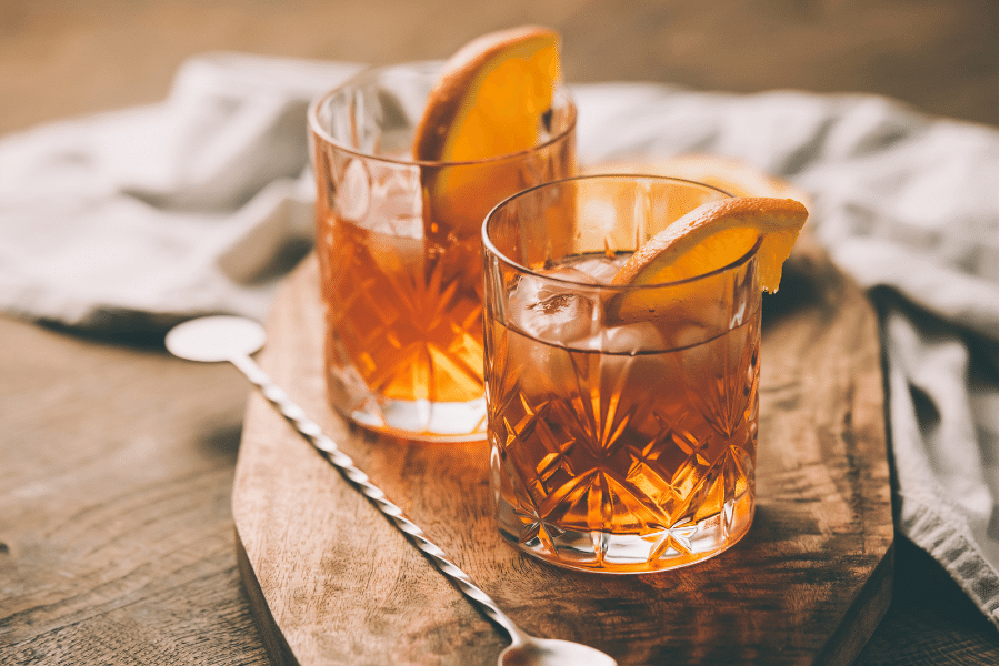 two cocktails on a wood table