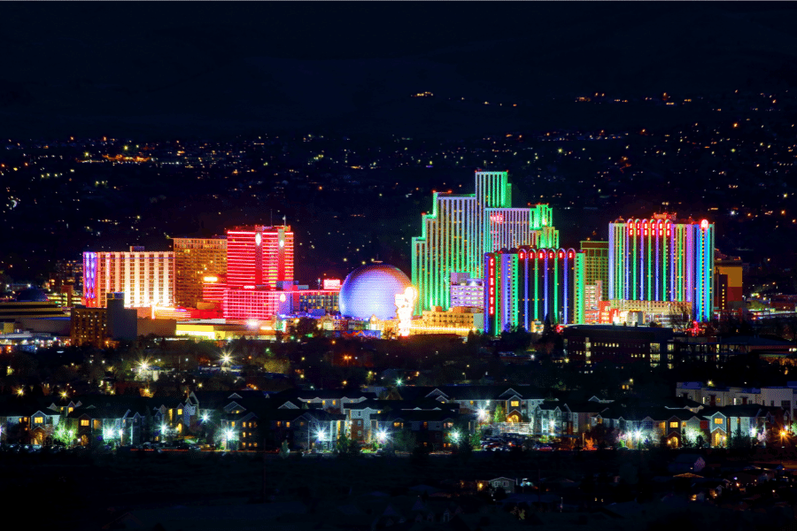 Reno, Nevada lit up in different colors at night 