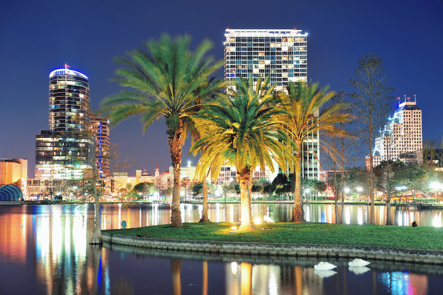Orlando, Florida Skyline at night bright lights buildings and palm trees