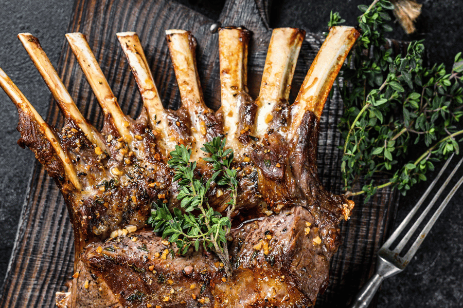 Image of a cook and seasoned rack of lamb