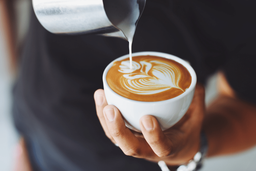 Barista creating beautiful latte art 