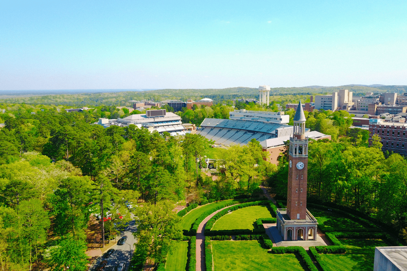University of North Carolina aerial view of the campus and clock tower on a sunny day in Chapel Hill