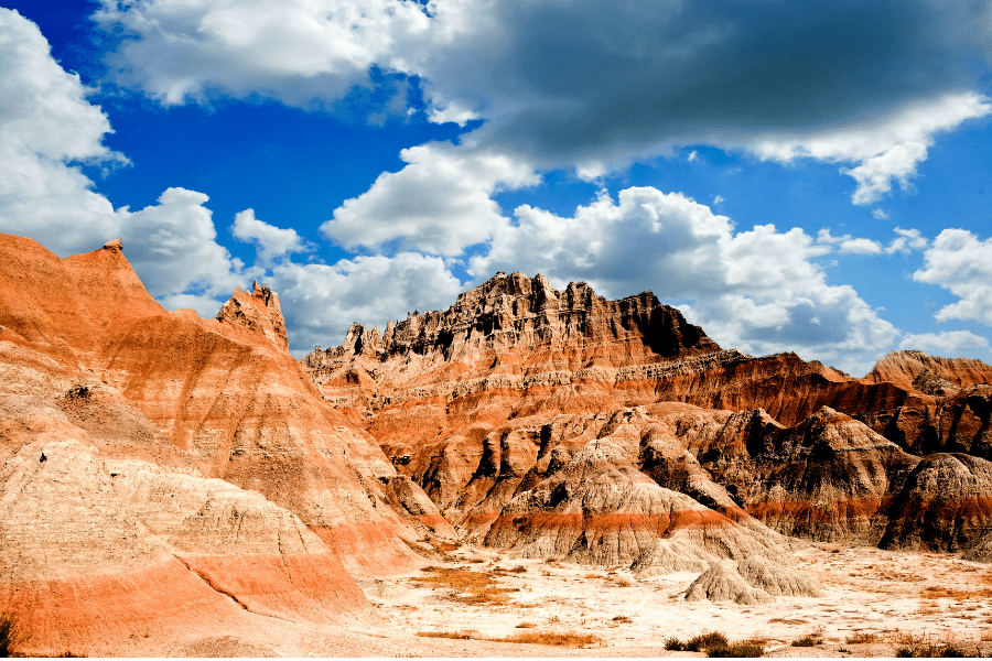 Badlands South Dakota on a sunny day with clouds in the sky