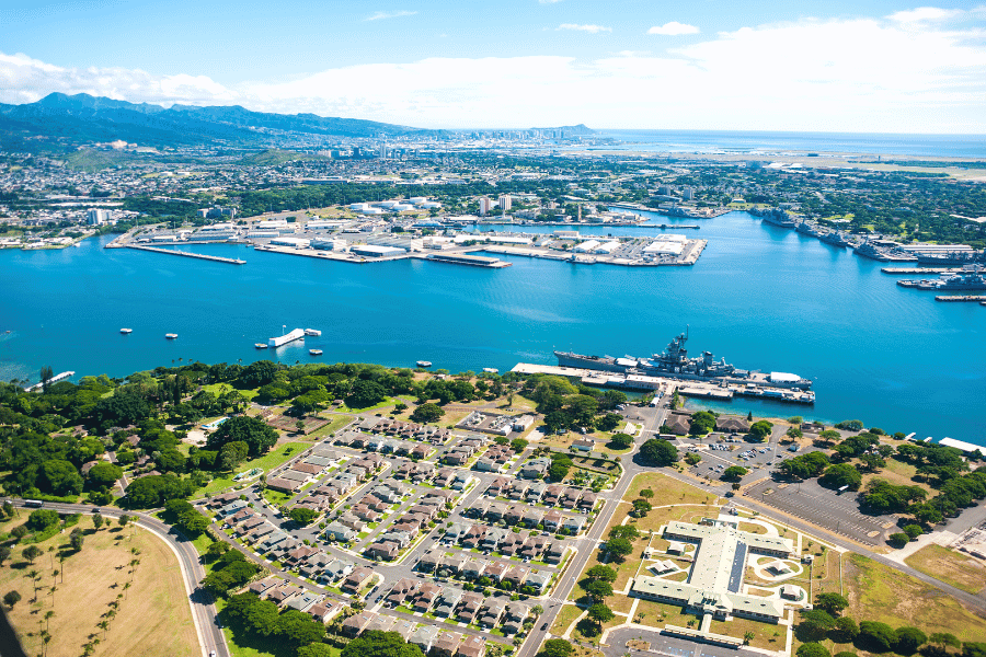 Aerial view of Pearl Harbor with battleship