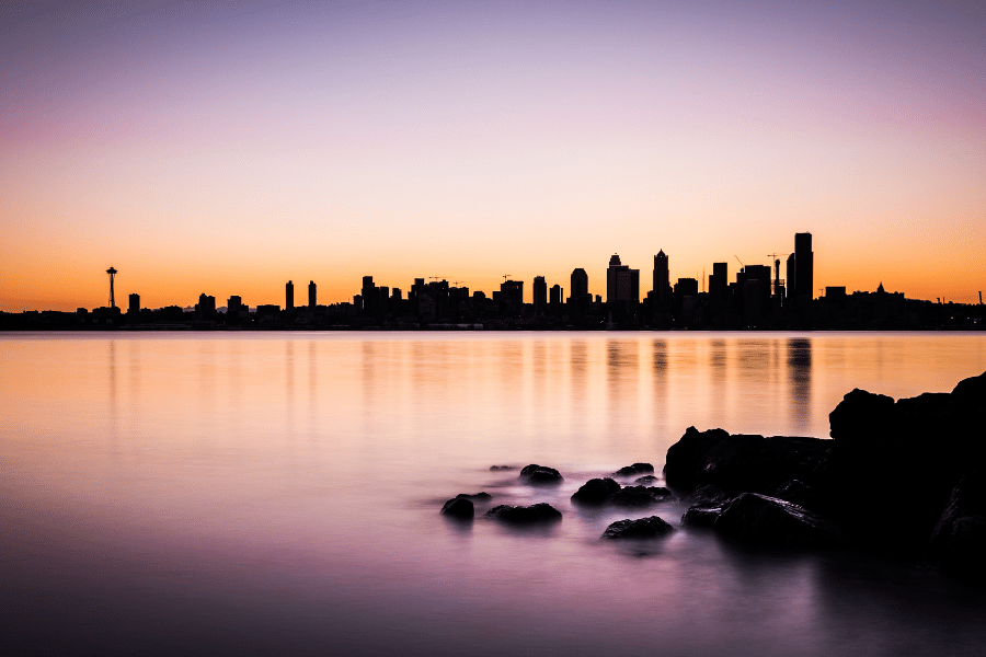Seattle, WA skyline with purple and orange sky 