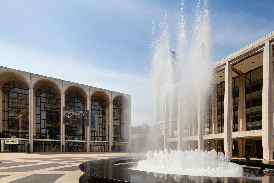 The American Ballet Theatre in Manhattan with a fountain out front 